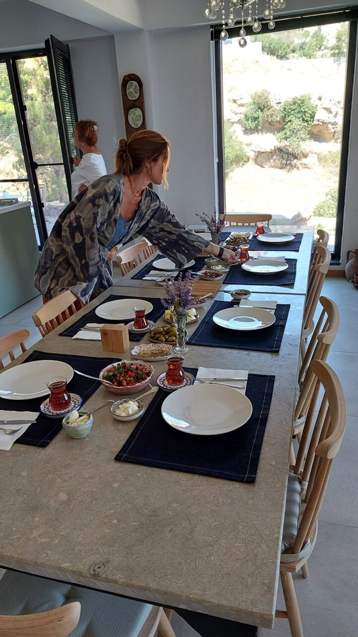 Working the clay at the long table