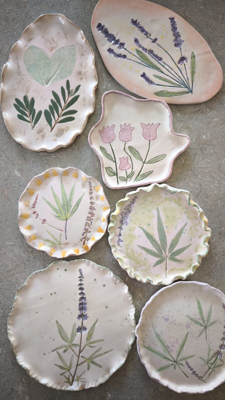 The finished ceramic plates, glazed with pressed lavender, leaves and flowers